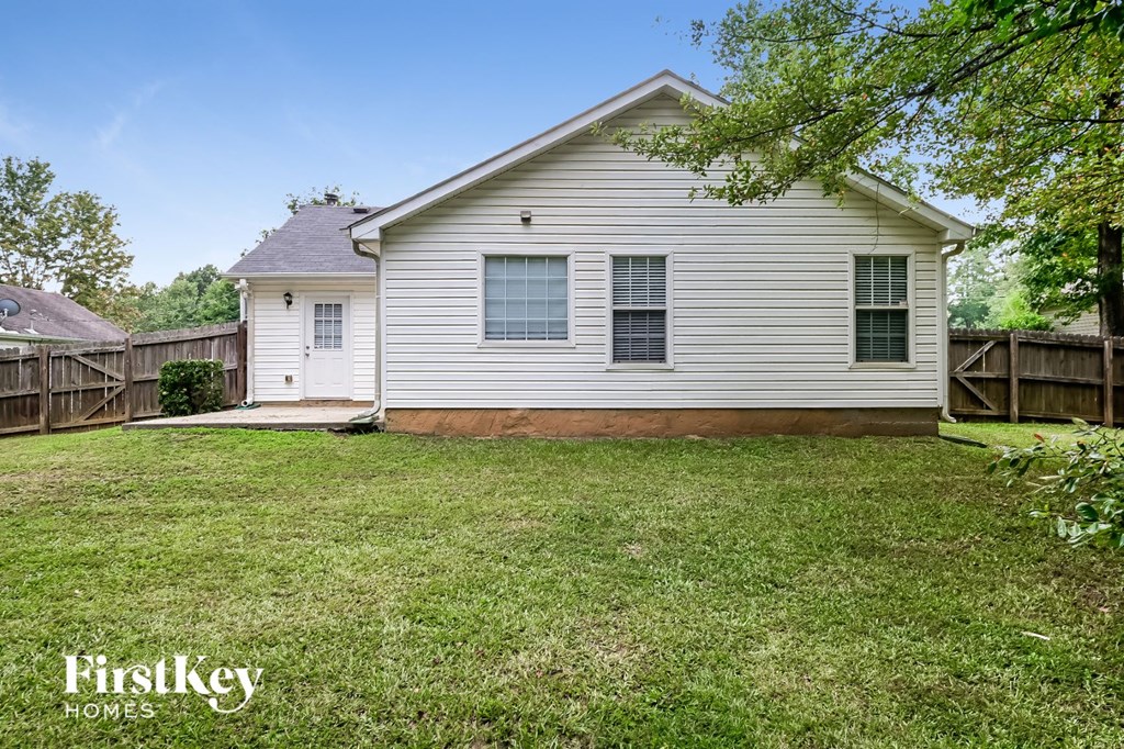 A house with a lawn in front of it.