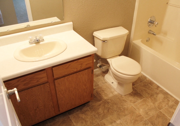 a bathroom with a sink toilet and a bath tub