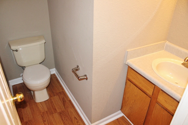 a bathroom with a toilet and a sink