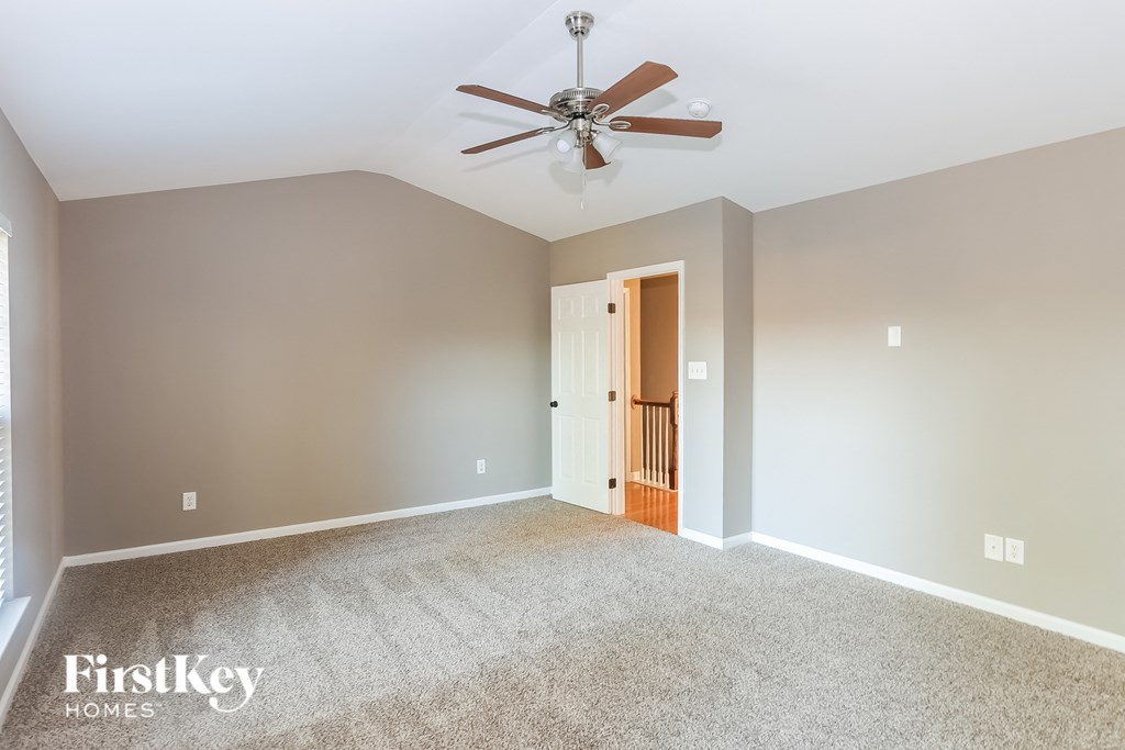 the master bedroom is spacious and has a ceiling fan
