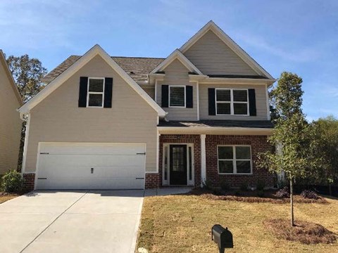 a house with a white garage door