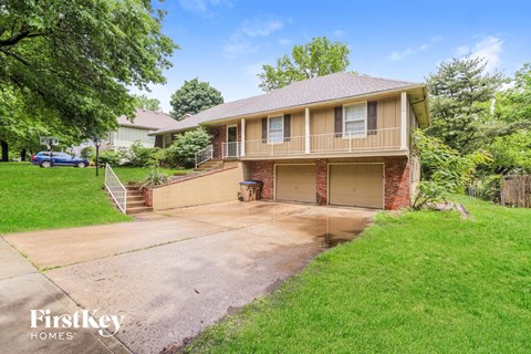 a house with a driveway and a garage door