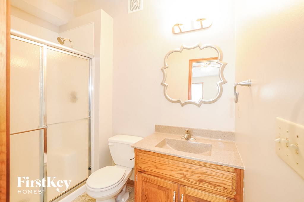 a bathroom with a sink toilet and a shower