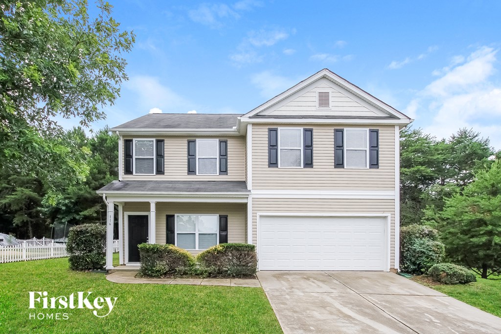 A two-story house with a garage is for sale by FirstKey Homes.