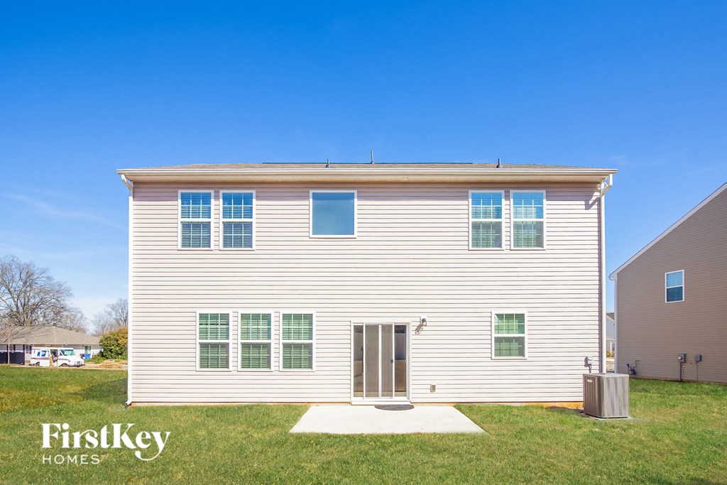 a white house with a blue sky in the background