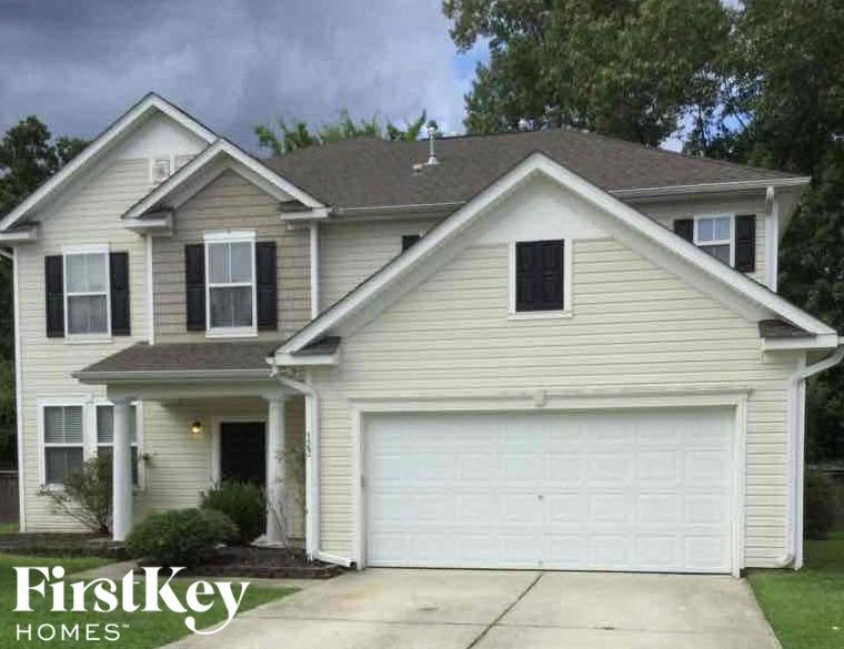 A two-story house with a garage is for sale by FirstKey Homes.