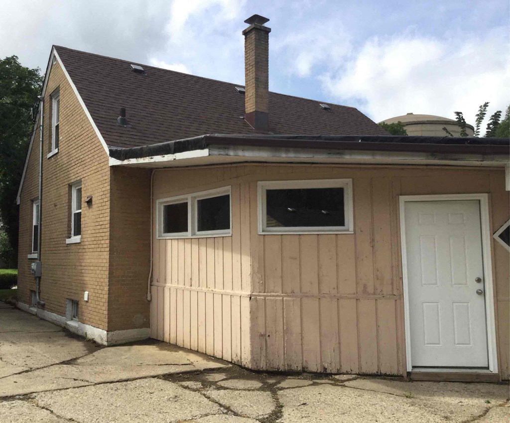 A house with a white door and windows.