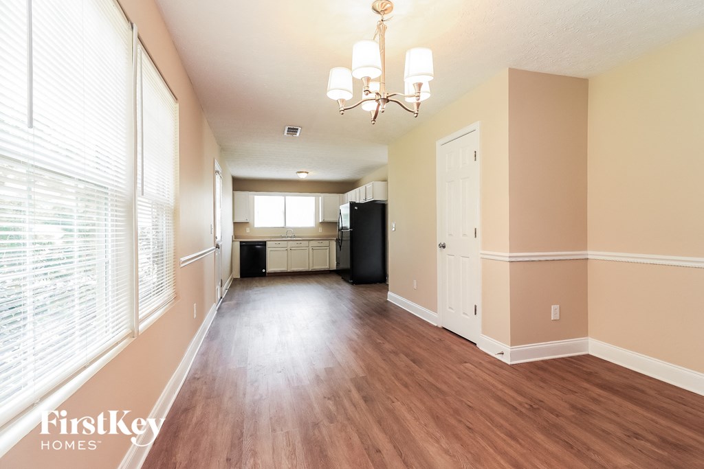 a view of the living room and kitchen from the dining room