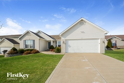 A house with a garage is for sale by FirstKey Homes.