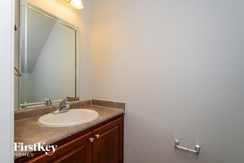 A bathroom sink with a mirror above it.