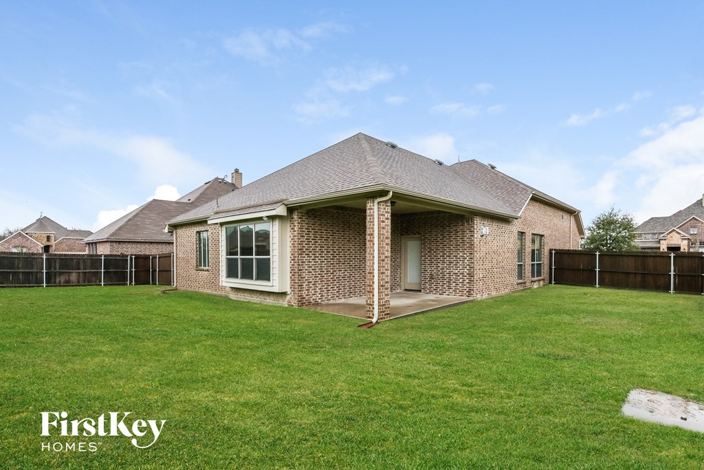 a house with a yard and a fisheye view of the backyard