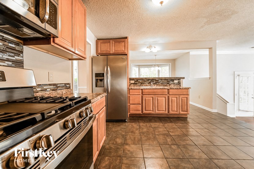 a kitchen with stainless steel appliances and wooden cabinets