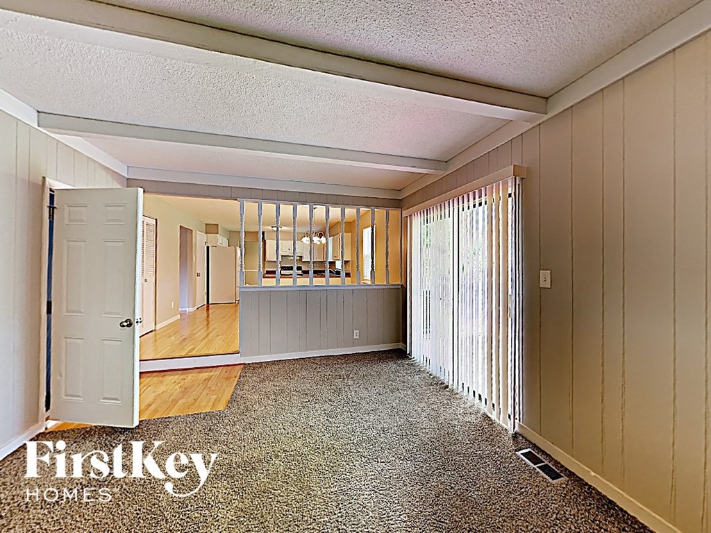 a view of the living room and dining room from the front door