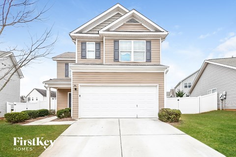 A two-story house with a garage is for sale by FirstKey Homes.