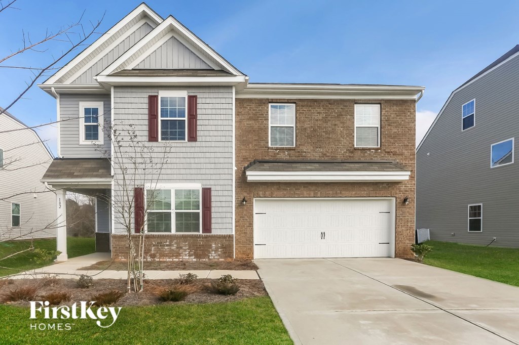 A two-story house with a garage is for sale by FirstKey Homes.