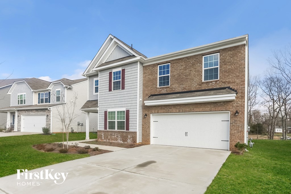 A house with a garage is for sale by FirstKey Homes.