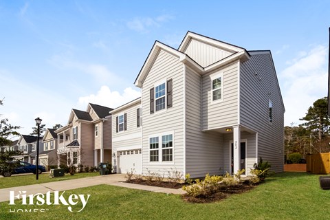 A house with the words "FirstKey Homes" on the front lawn.