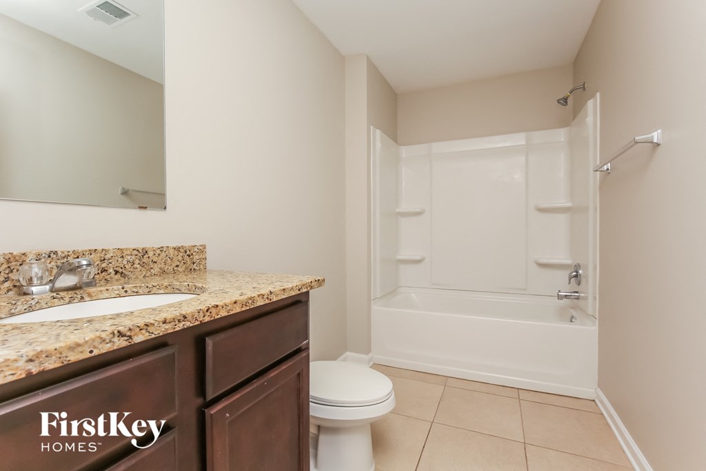 a bathroom with a sink toilet and a shower