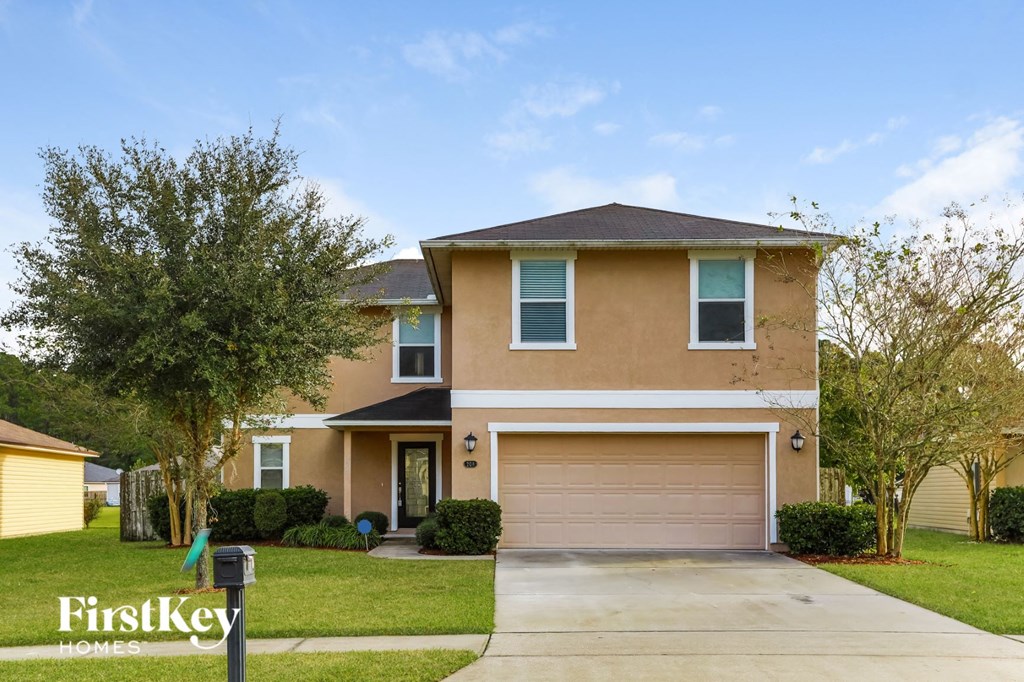 a house with a driveway and a garage door