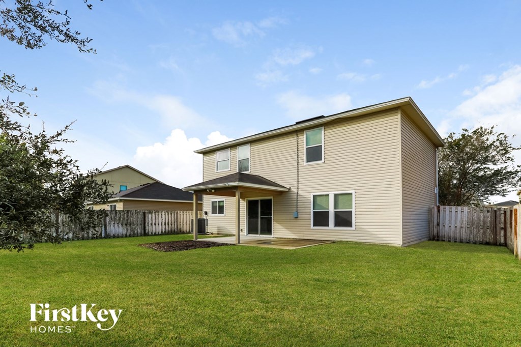 a house with a yard in front of it