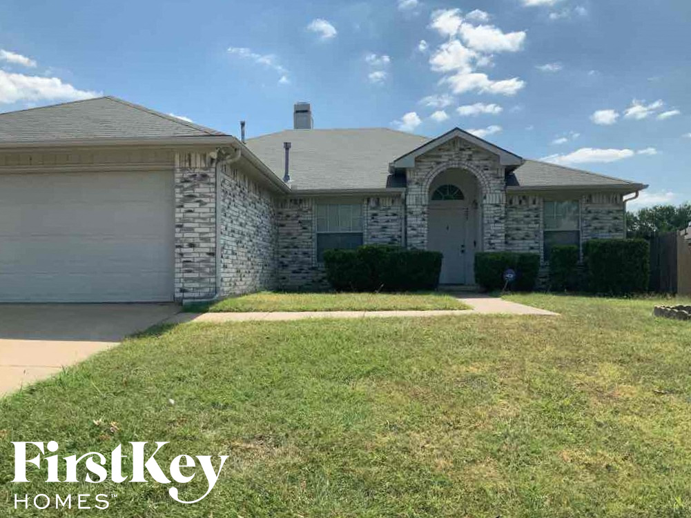 a house with a lawn in front of it