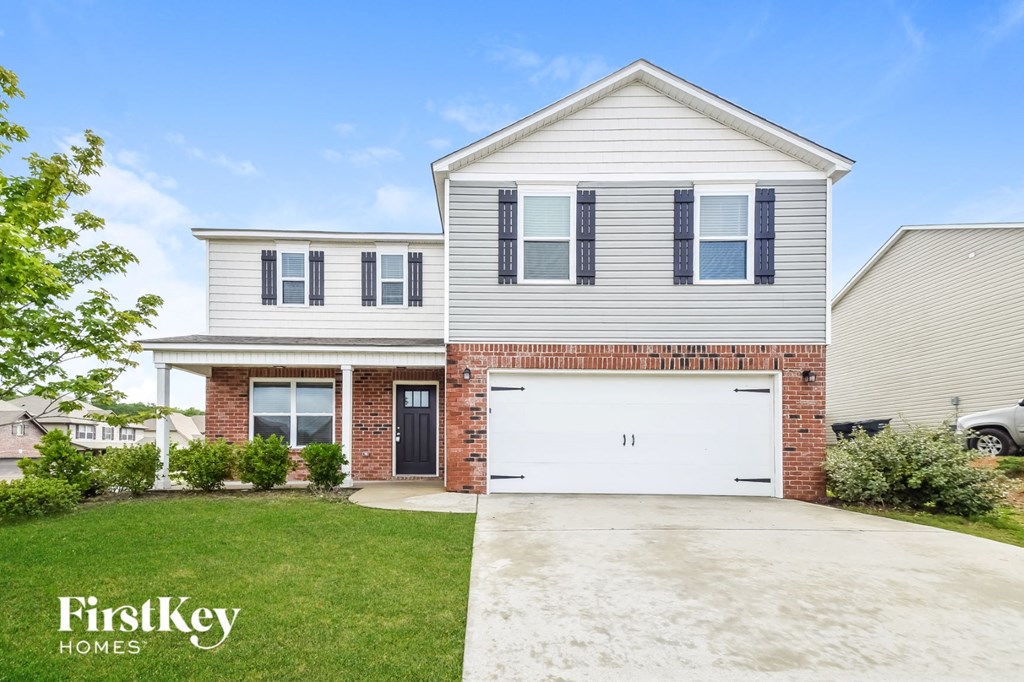 a white house with a white garage door