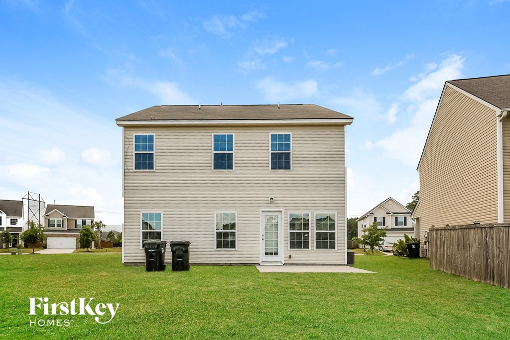 A two-story house with a garage is for sale by FirstKey Homes.