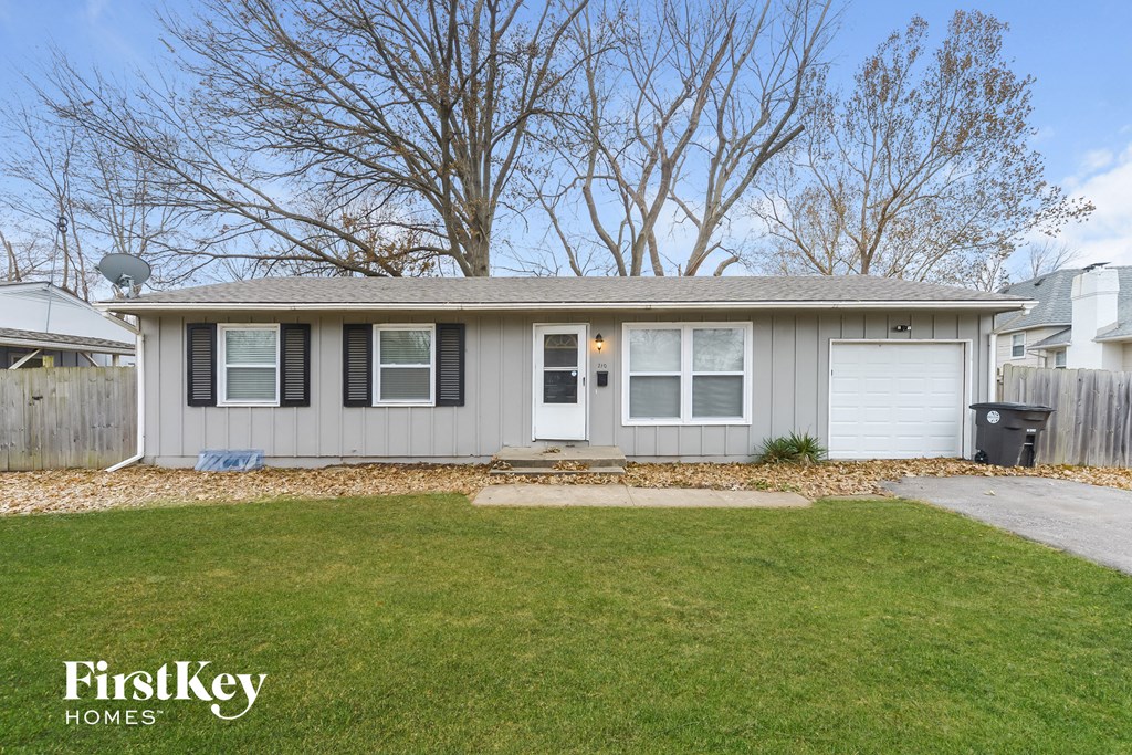 A house with a grey roof and a white door is shown with the words "FirstKey Homes" on the bottom left.