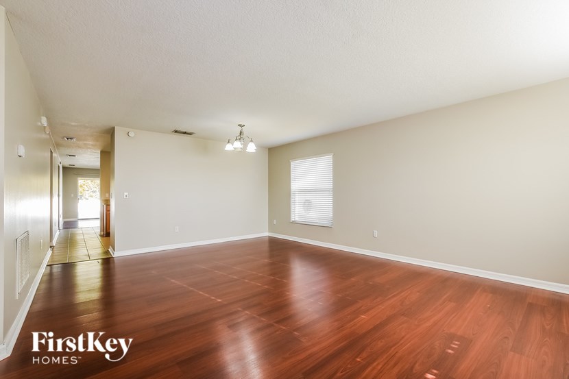 A room with wooden floors and a white ceiling.