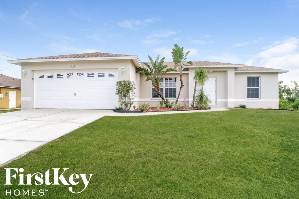 a house with a lawn in front of it