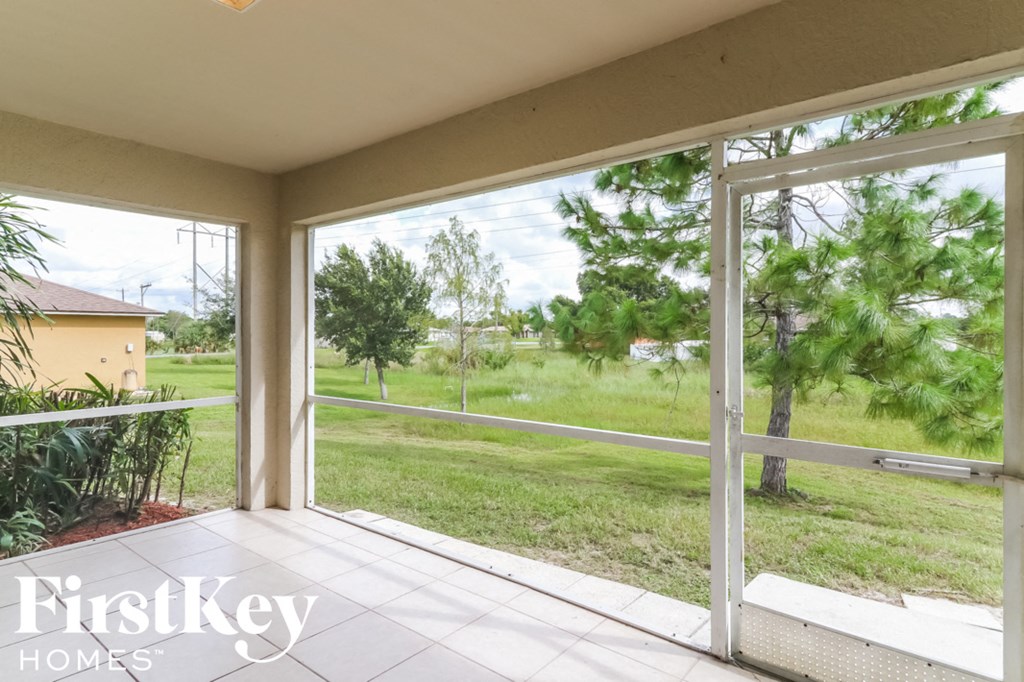 a view of the yard from the screened porch of a home