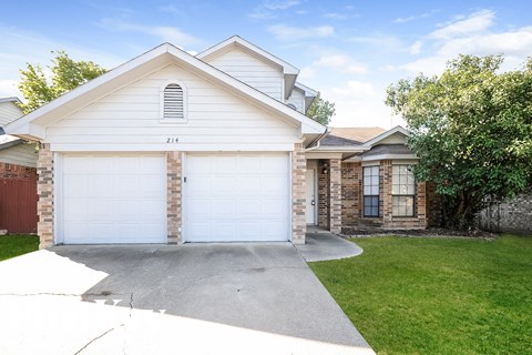 A two-car garage is attached to a house.