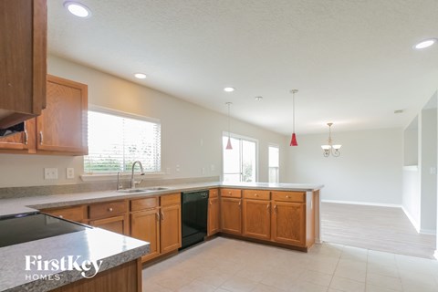 a kitchen with wooden cabinets and a counter top