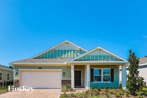 a house with a garage door and a roof