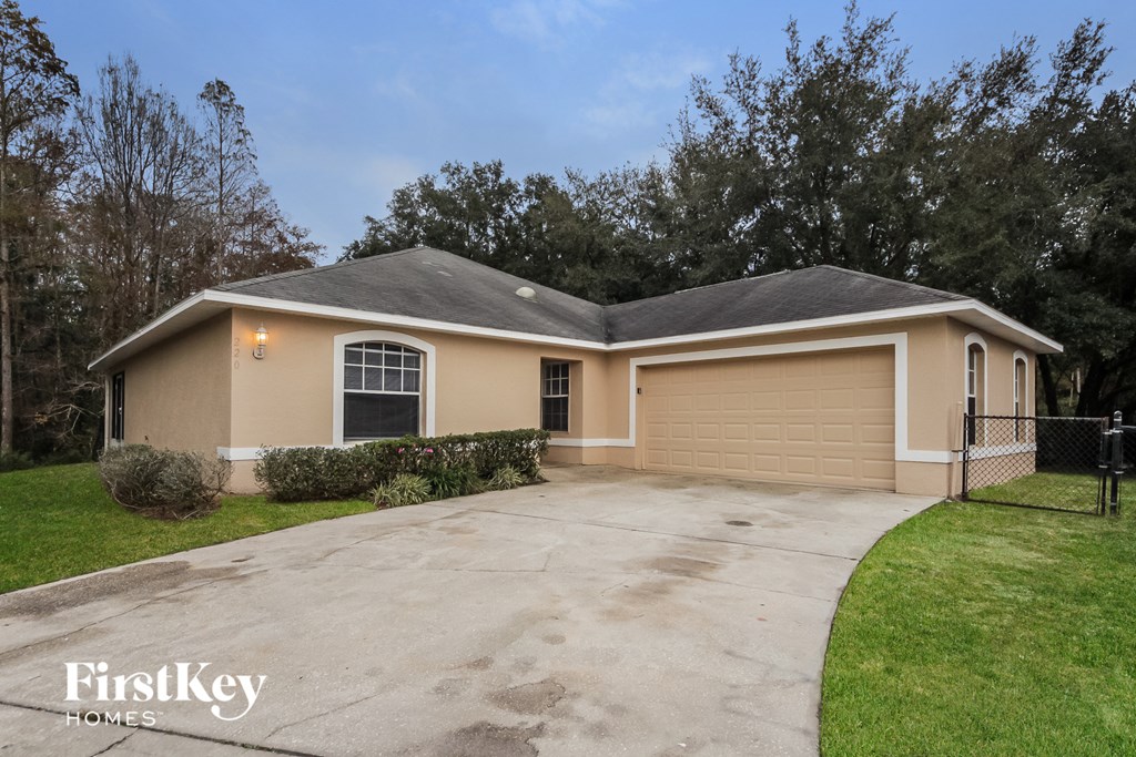 A house with a garage is for sale by FirstKey Homes.