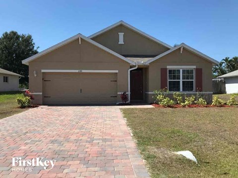 a house with a driveway and a garage door