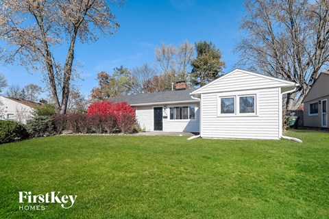 A house with a lawn in front of it.