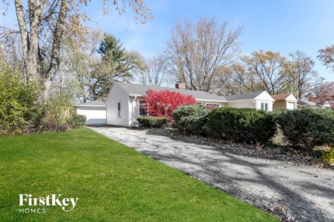 A house with a lawn in front of it.