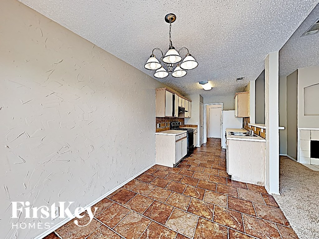 a view of the kitchen and dining area from the living room