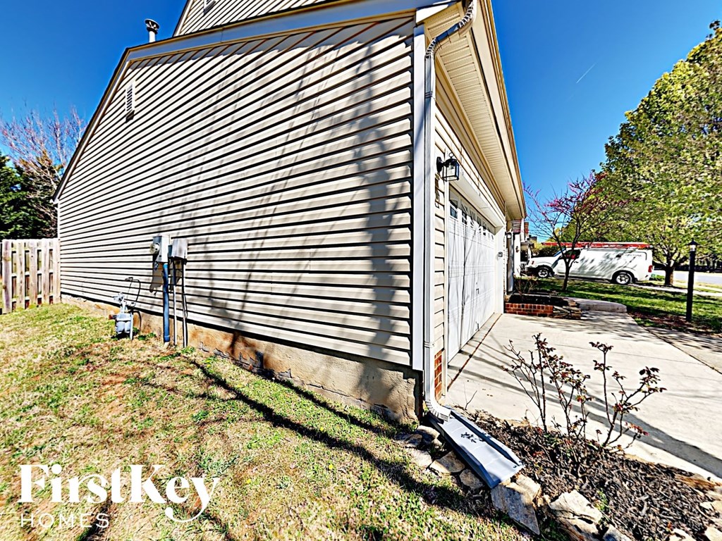 A house with a garage door is shown in the image.