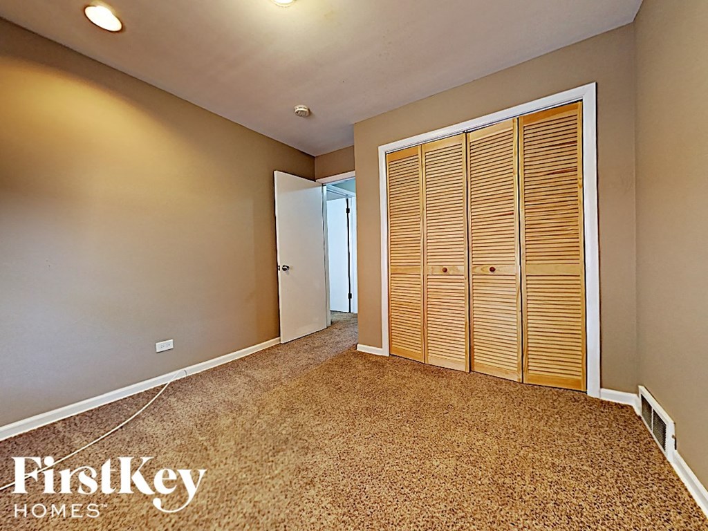 the master bedroom has two closets and a door to the hallway