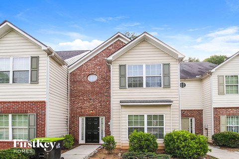 a brick and with a sidewalk in front of it