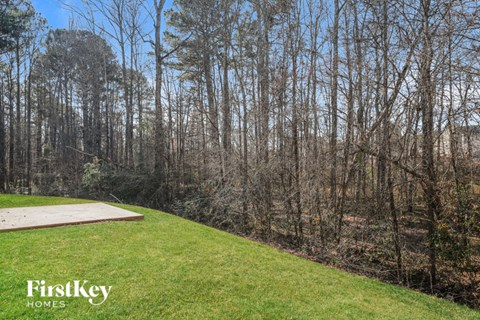 A grassy area with a FirstKey Homes logo.
