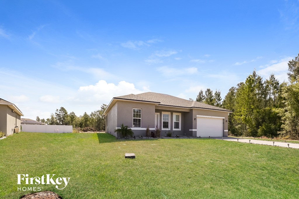 a home with a large yard and a house