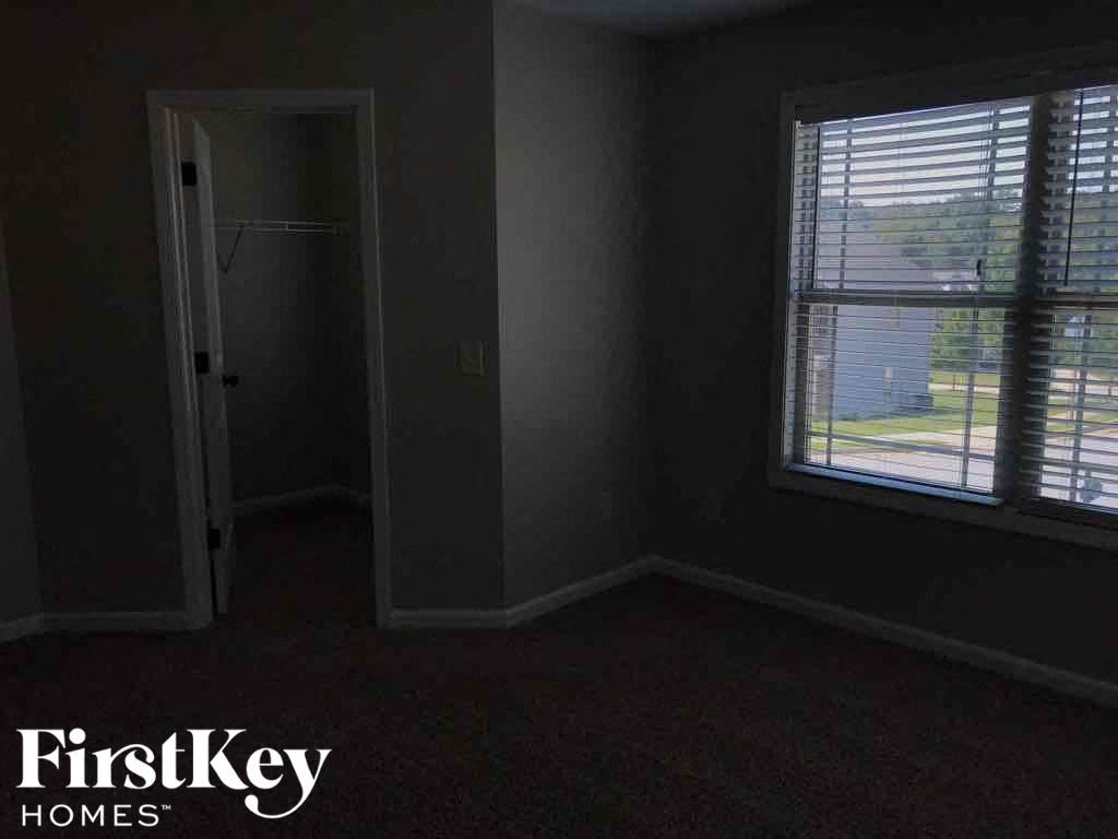 A room with a window and a door is shown.