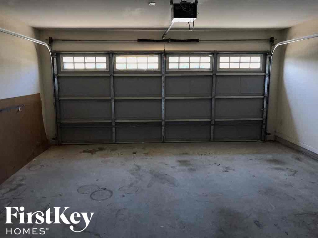 A large garage with a FirstKey Homes logo.