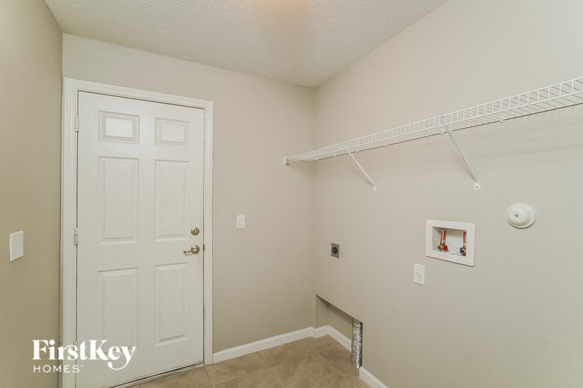 a bedroom with a closet and a white door