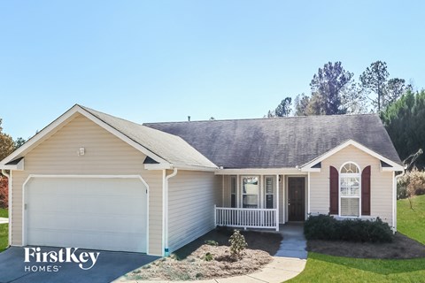 a house with a porch and a white door