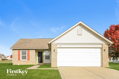 A house with a garage door and a sign that says FirstKey Homes.