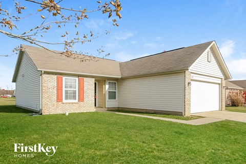 A house with a garage is for sale by FirstKey Homes.